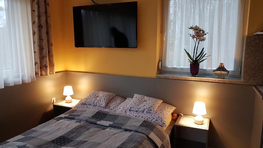 Postel nebo postele na pokoji v ubytování Levendulás Vendégház