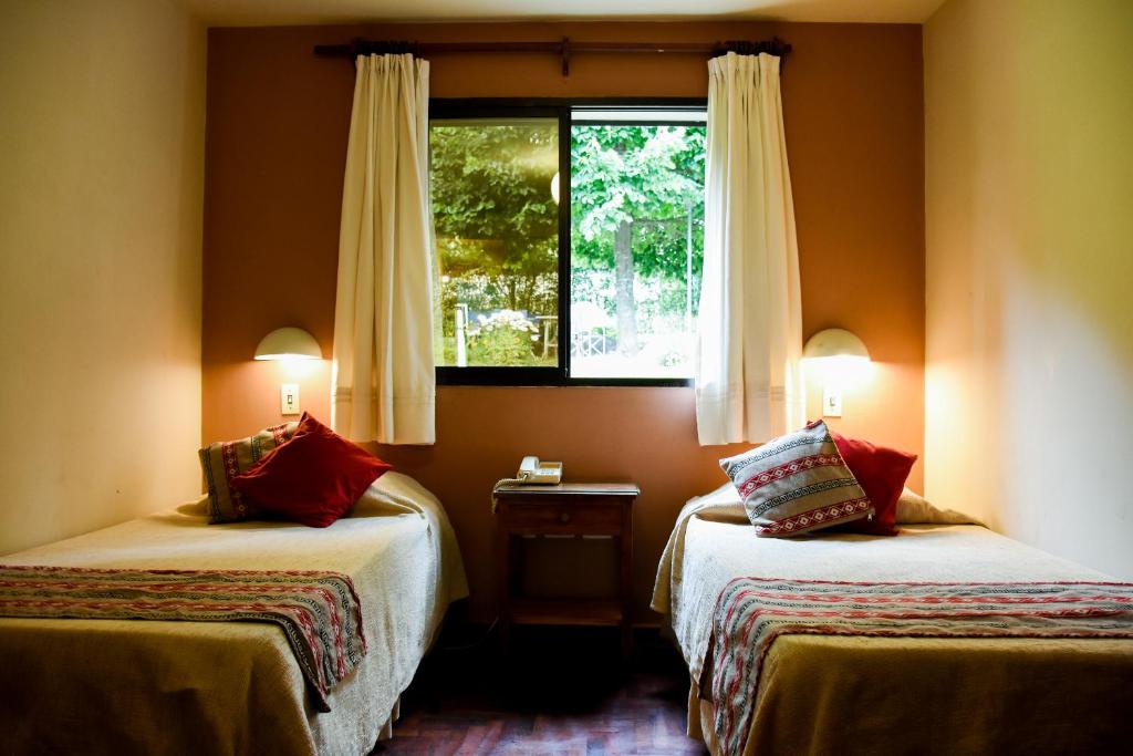 Voodi või voodid majutusasutuse Hotel Tafí toas