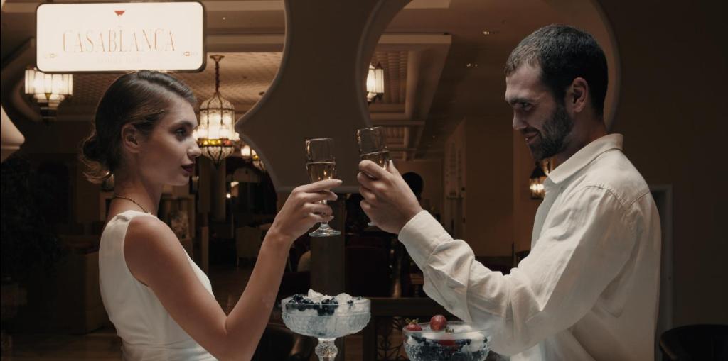 a man and a woman holding glasses of wine at Spice Hotel & Spa - Ultra All Inclusive in Belek