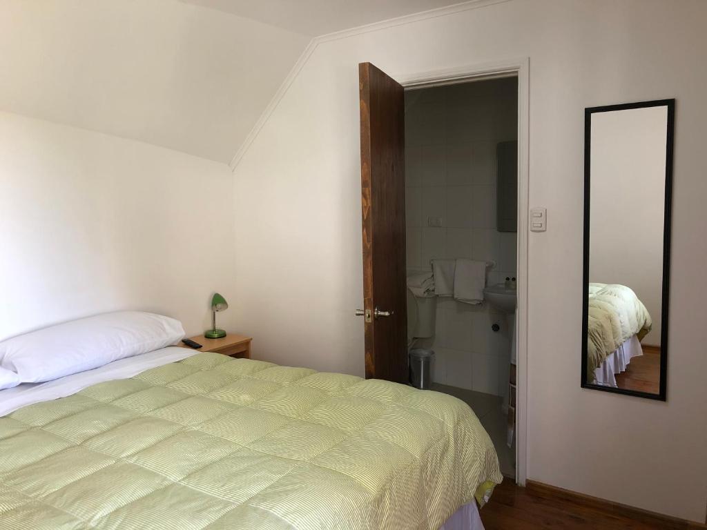 Postel nebo postele na pokoji v ubytování Hostal Recreo