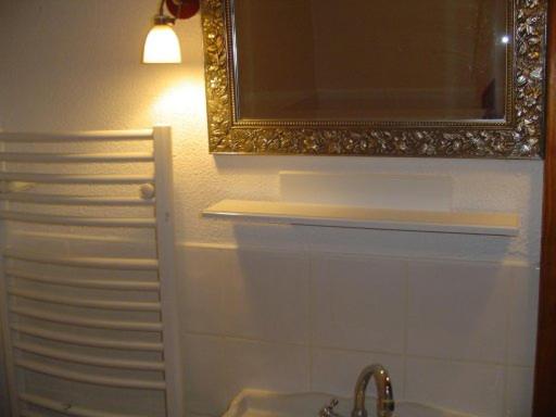 a bathroom with a mirror and a sink at Romantic-Louveteaux-en-Provence**** in Saint-Pierre