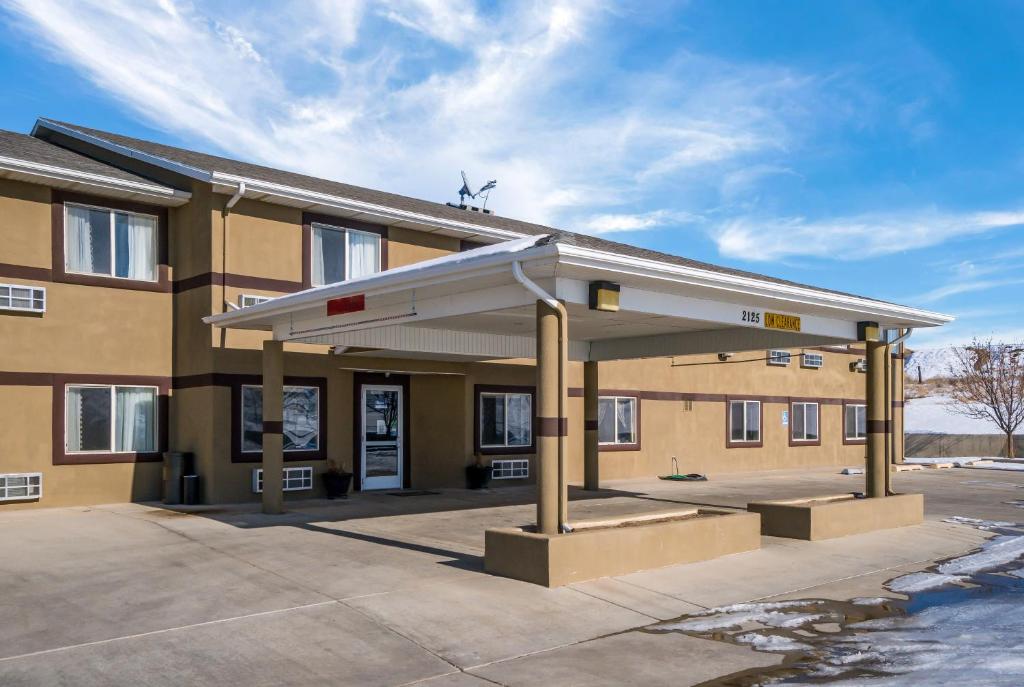 a building with a gas station at Americas Best Value Inn Green River in Green River