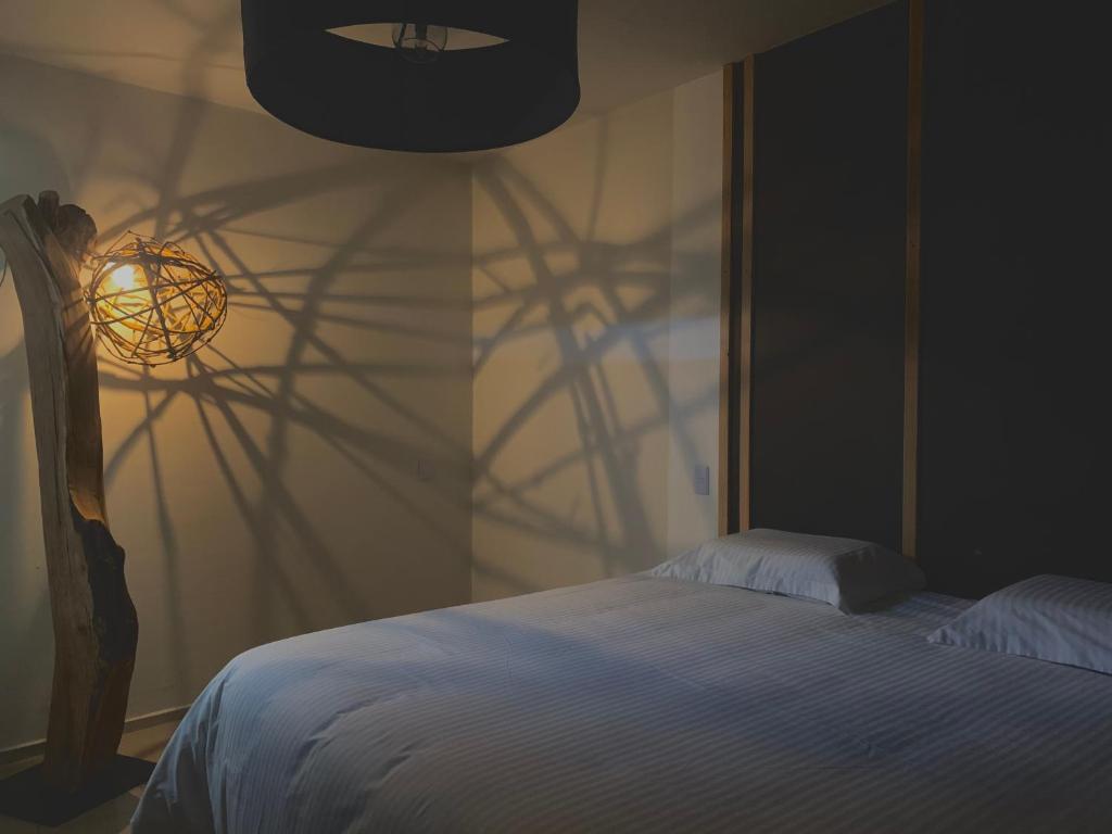 Postel nebo postele na pokoji v ubytování Hotel Portal & Suites