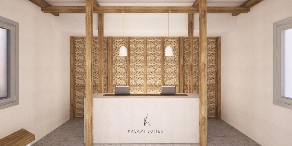 利瓦迪奧的住宿－Kalami Suites，大堂设有一张桌子,上面放有两台笔记本电脑