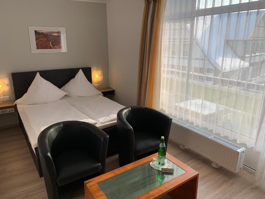 Postel nebo postele na pokoji v ubytování Hotel Martina