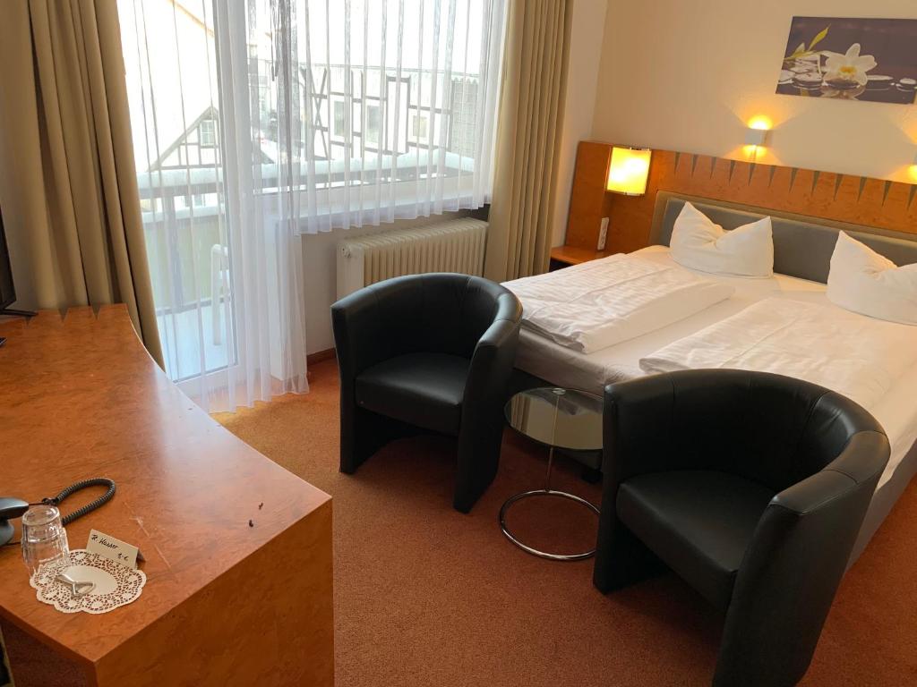 Postel nebo postele na pokoji v ubytování Hotel Martina