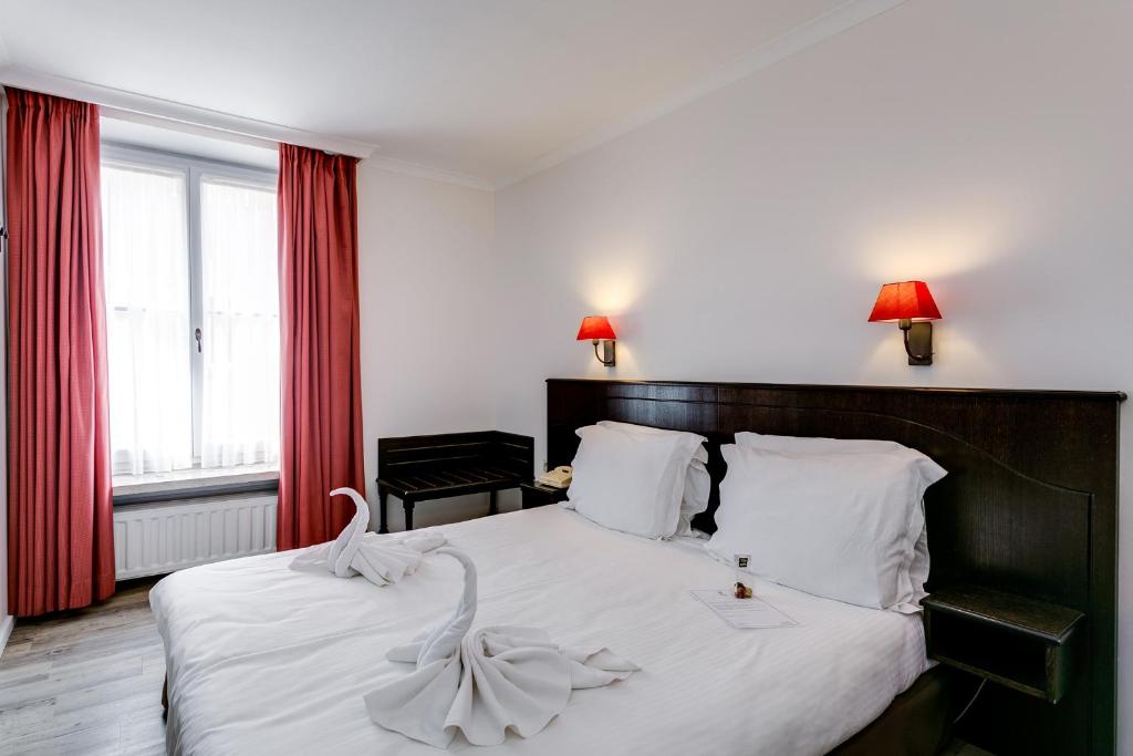 Postel nebo postele na pokoji v ubytování Hotel Bryghia