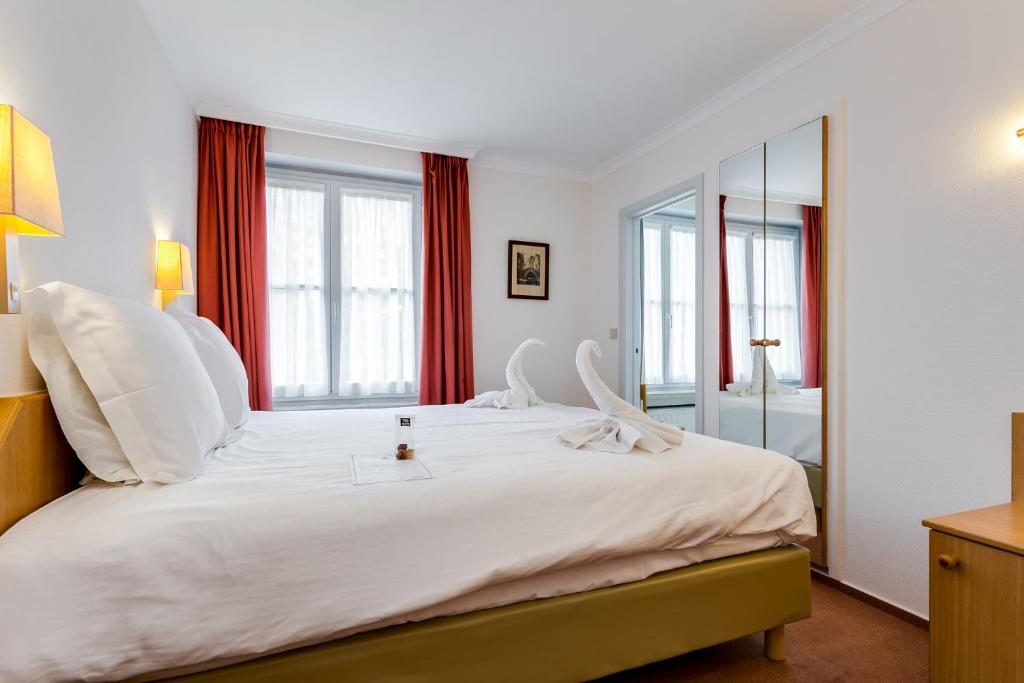 Postel nebo postele na pokoji v ubytování Hotel Bryghia