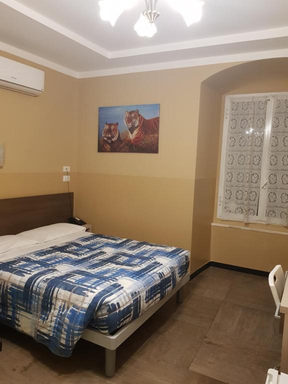 Postel nebo postele na pokoji v ubytování Hotel Tommaseo