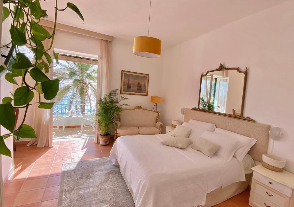 Postel nebo postele na pokoji v ubytování Villa Bina Sea Hotel