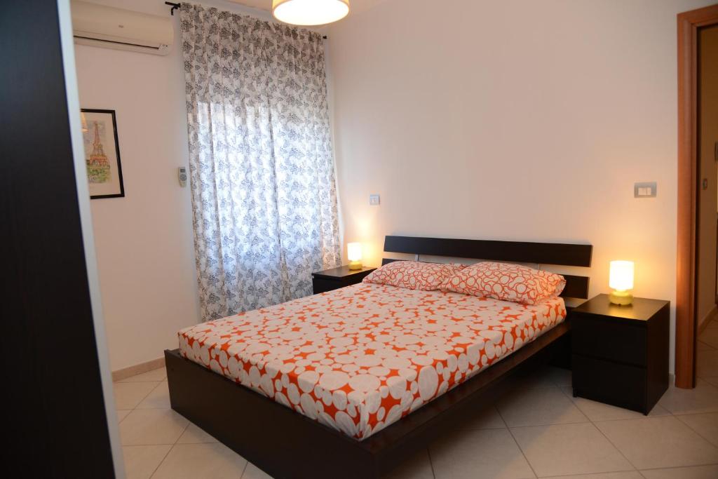 Postel nebo postele na pokoji v ubytování Jonico Guest House