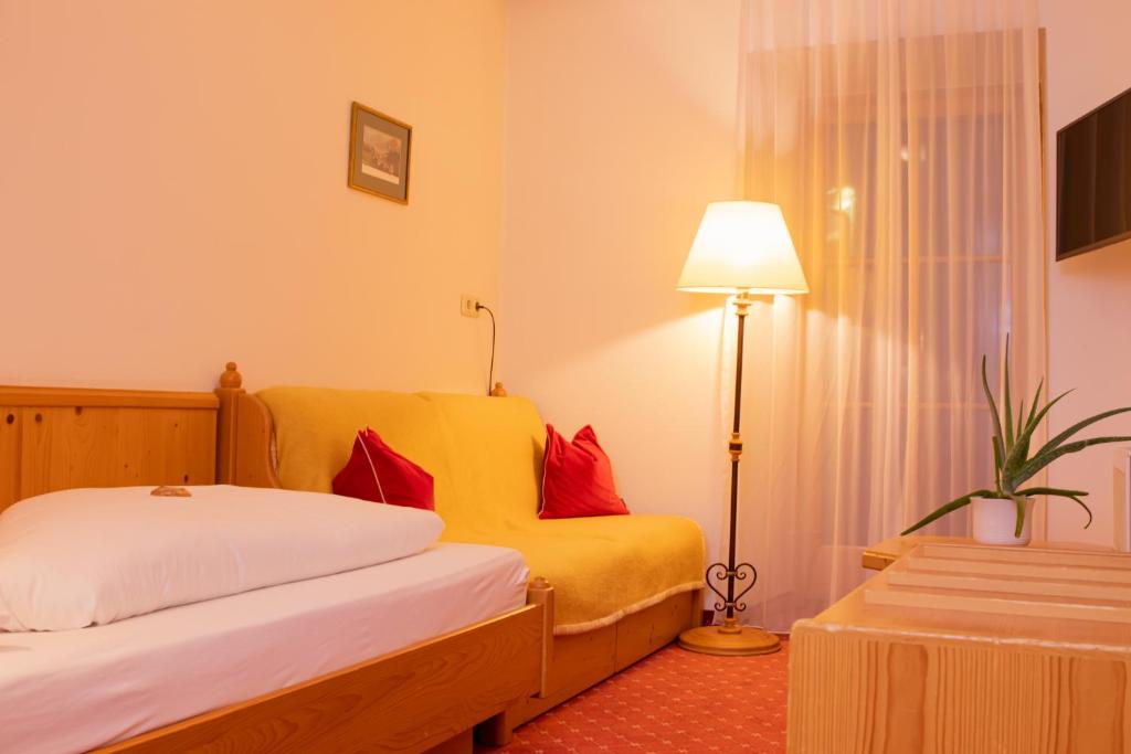 Postel nebo postele na pokoji v ubytování Hotel Zimmerbräu