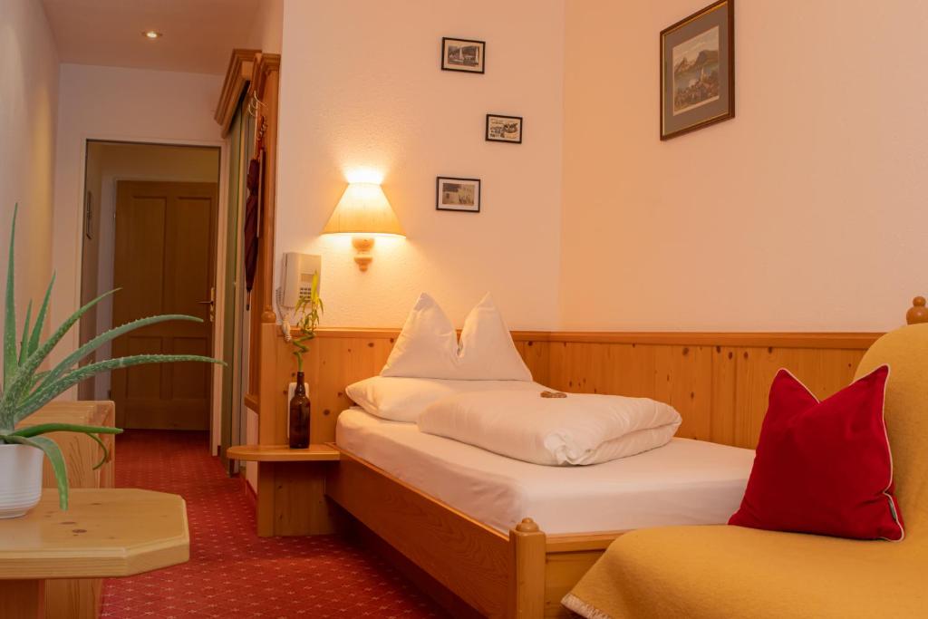 Postel nebo postele na pokoji v ubytování Hotel Zimmerbräu