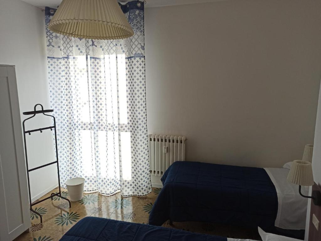 Posteľ alebo postele v izbe v ubytovaní Like Home Cisanello