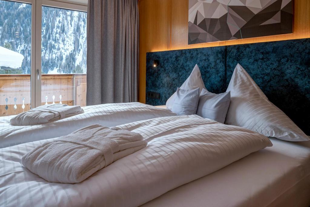 Postel nebo postele na pokoji v ubytování Das Unterrain Lifestyle Hotel