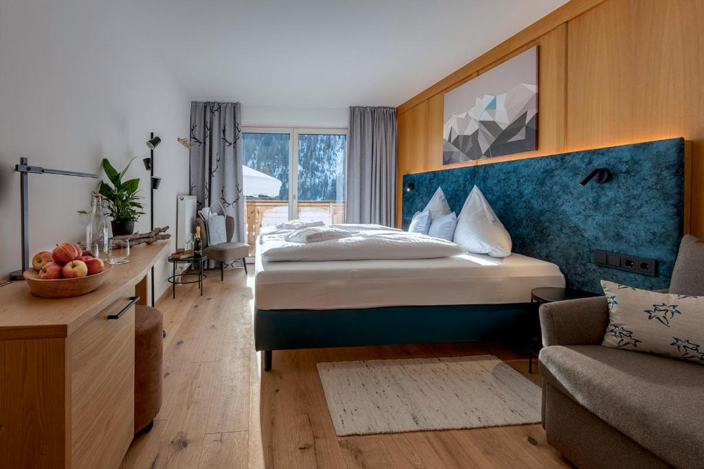 Postel nebo postele na pokoji v ubytování Das Unterrain Lifestyle Hotel