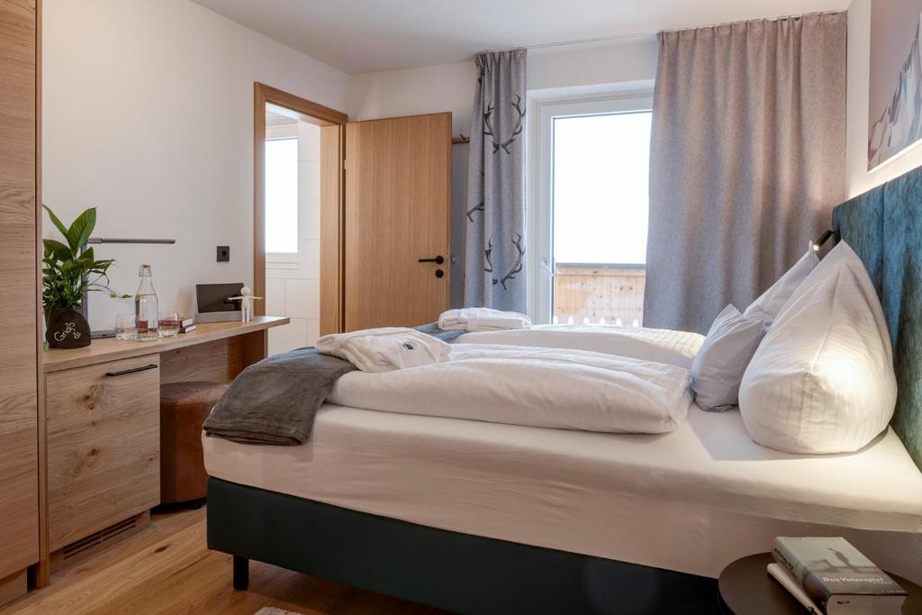Postel nebo postele na pokoji v ubytování Das Unterrain Lifestyle Hotel