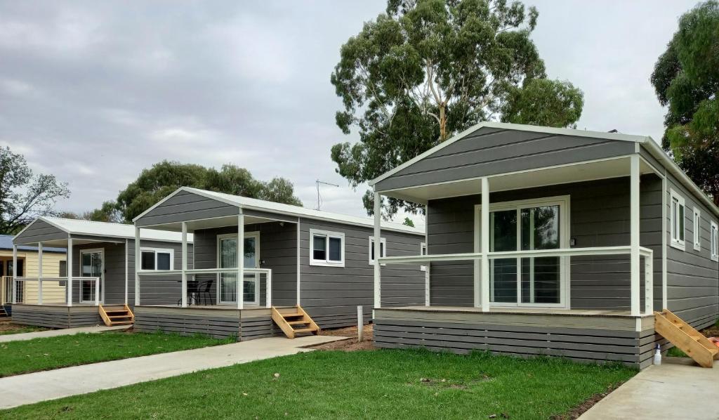 a couple of modular homes in a yard at Young Tourist Park in Young
