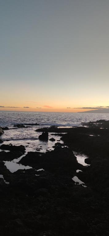 a view of the ocean at sunset at Janias Alcalà Apartment in Alcalá