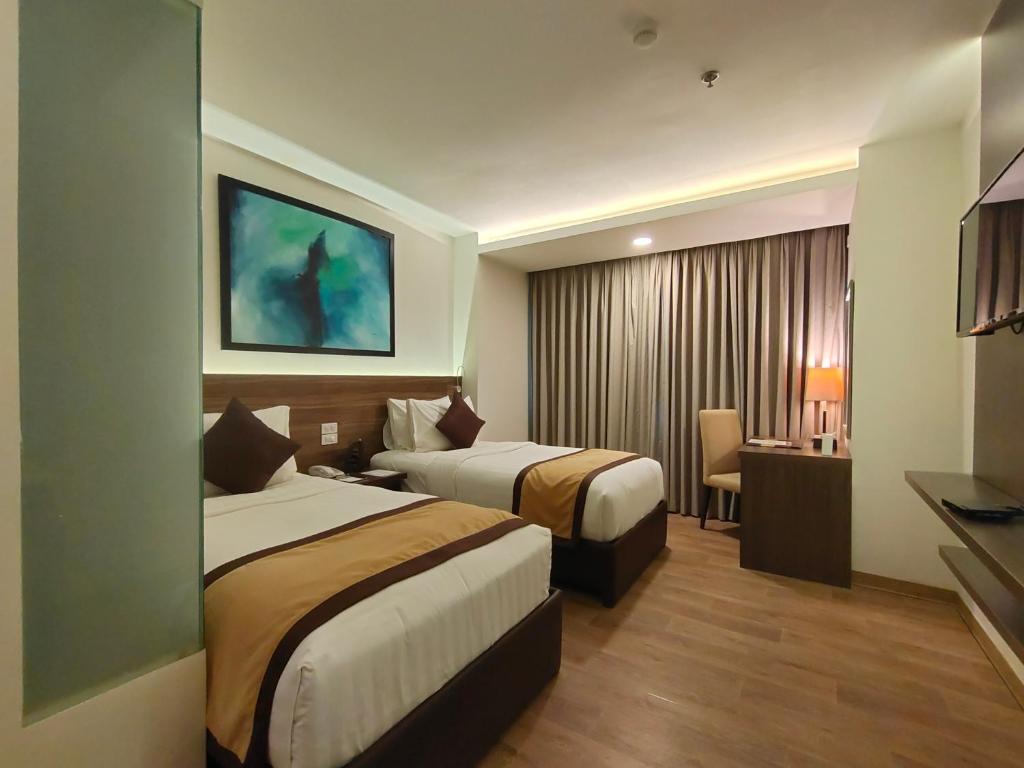 Postel nebo postele na pokoji v ubytování Hotel Marciano