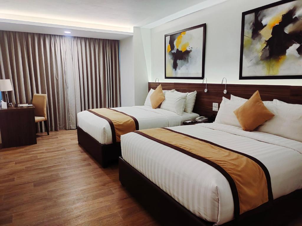 Postel nebo postele na pokoji v ubytování Hotel Marciano