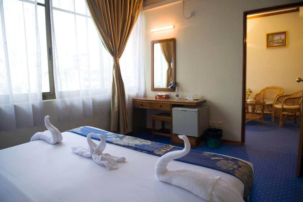Postel nebo postele na pokoji v ubytování Panorama Hotel
