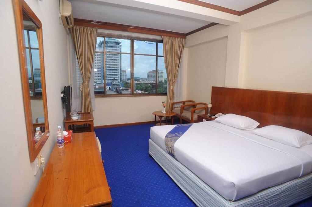 Postel nebo postele na pokoji v ubytování Panorama Hotel