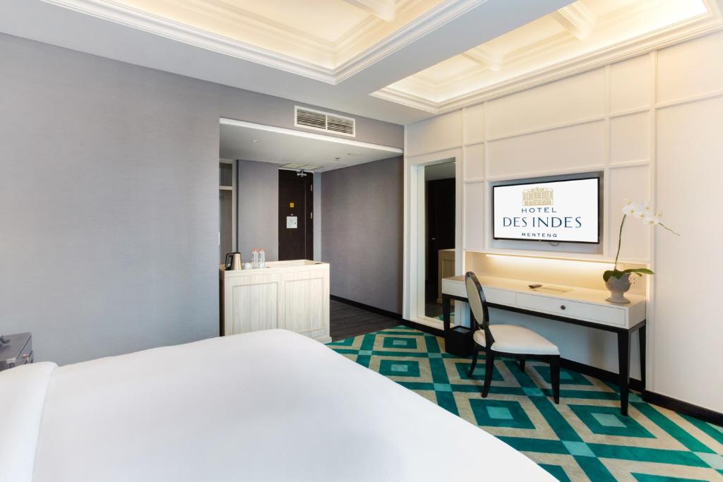 Postel nebo postele na pokoji v ubytování Hotel Des Indes Menteng