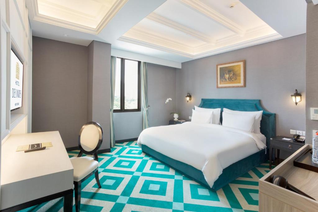 Postel nebo postele na pokoji v ubytování Hotel Des Indes Menteng