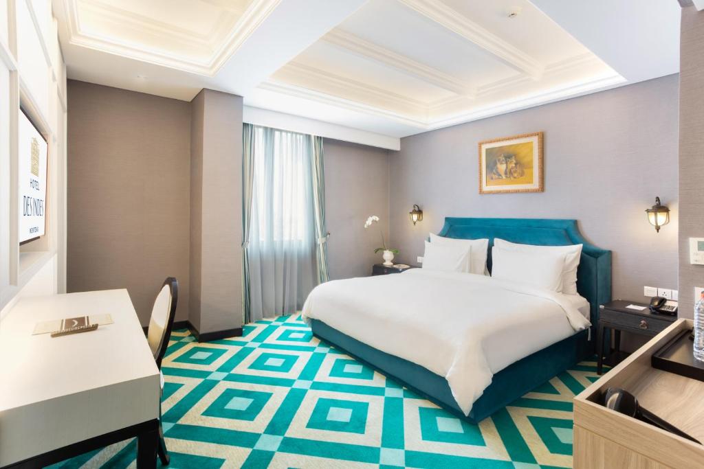Postel nebo postele na pokoji v ubytování Hotel Des Indes Menteng