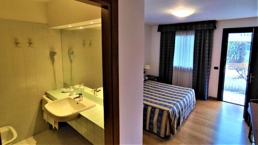 Posteľ alebo postele v izbe v ubytovaní Hotel Luna