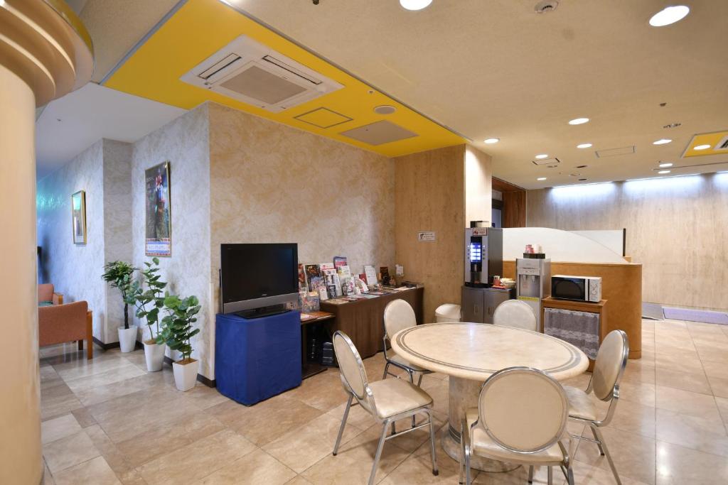 TV a/nebo společenská místnost v ubytování Bell's Inn Tsuchiura