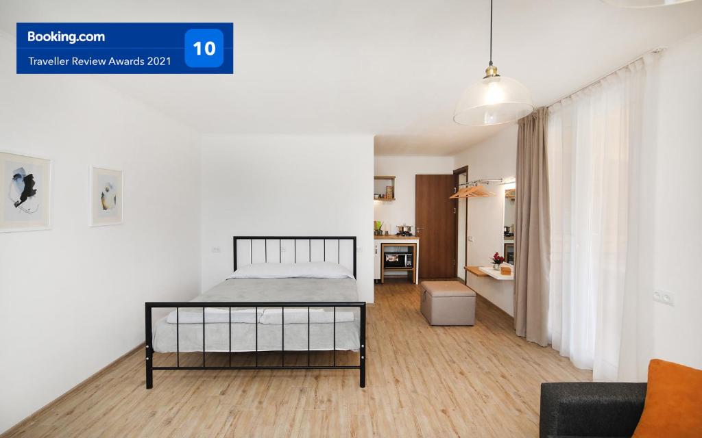 a bedroom with a bed and a living room at Twins in Tbilisi City