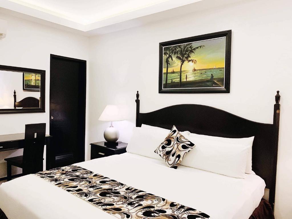 Postel nebo postele na pokoji v ubytování Chateau De Boracay