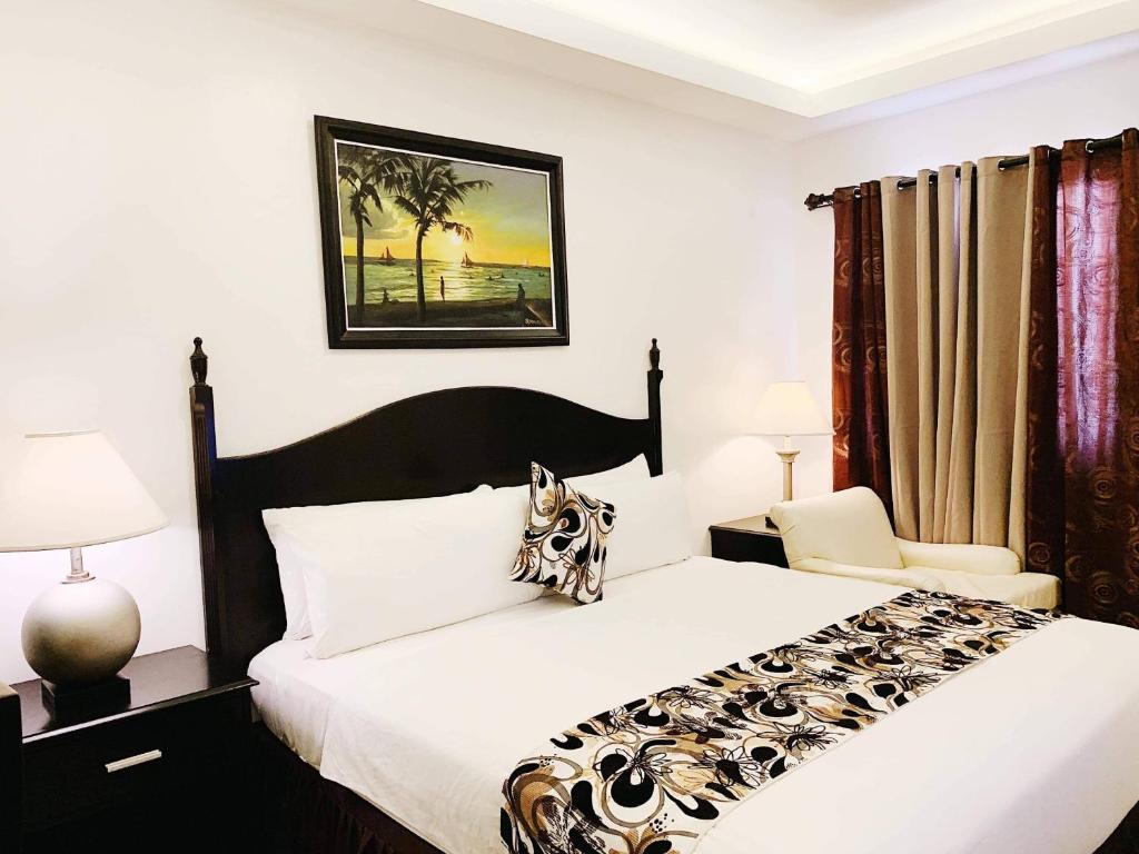 Postel nebo postele na pokoji v ubytování Chateau De Boracay