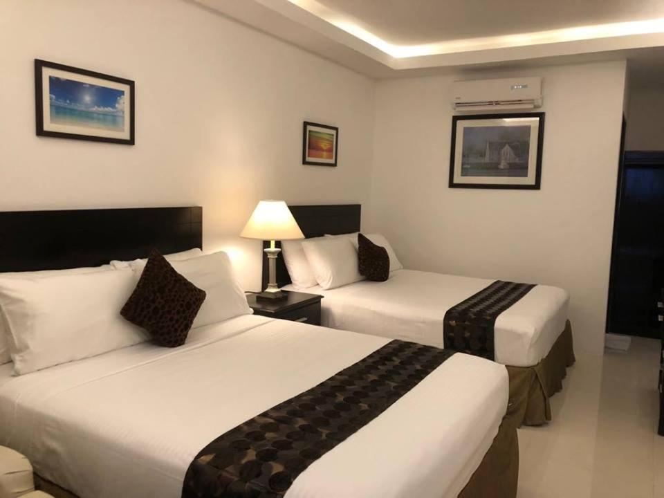 Postel nebo postele na pokoji v ubytování Chateau De Boracay