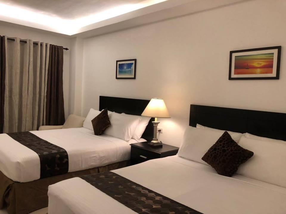 Postel nebo postele na pokoji v ubytování Chateau De Boracay