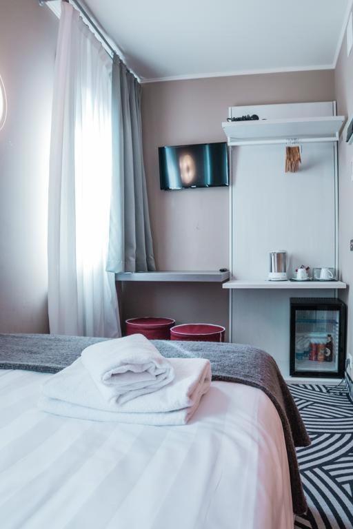 Postel nebo postele na pokoji v ubytování Hotel Cannaregio 2357