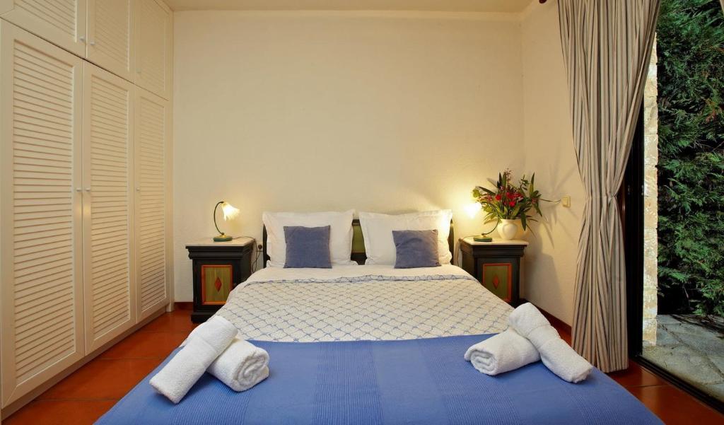 A bed or beds in a room at Villa Erato - Your Dream Getaway in Sani Seaside