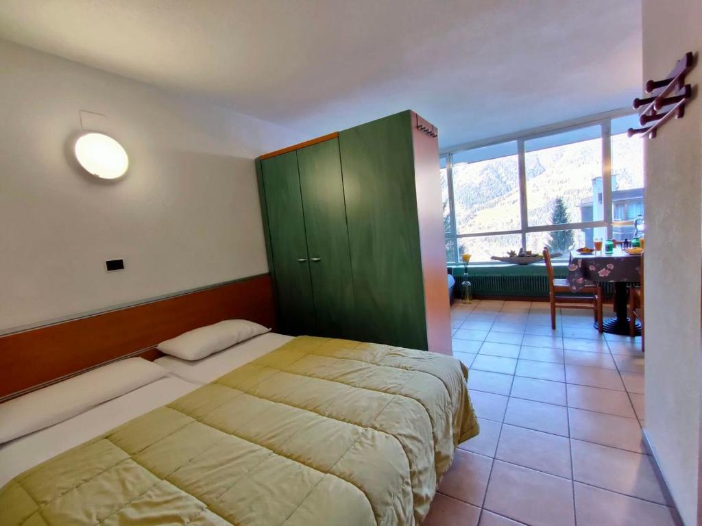 Postel nebo postele na pokoji v ubytování Residence Lores 2 - Go Vacanze