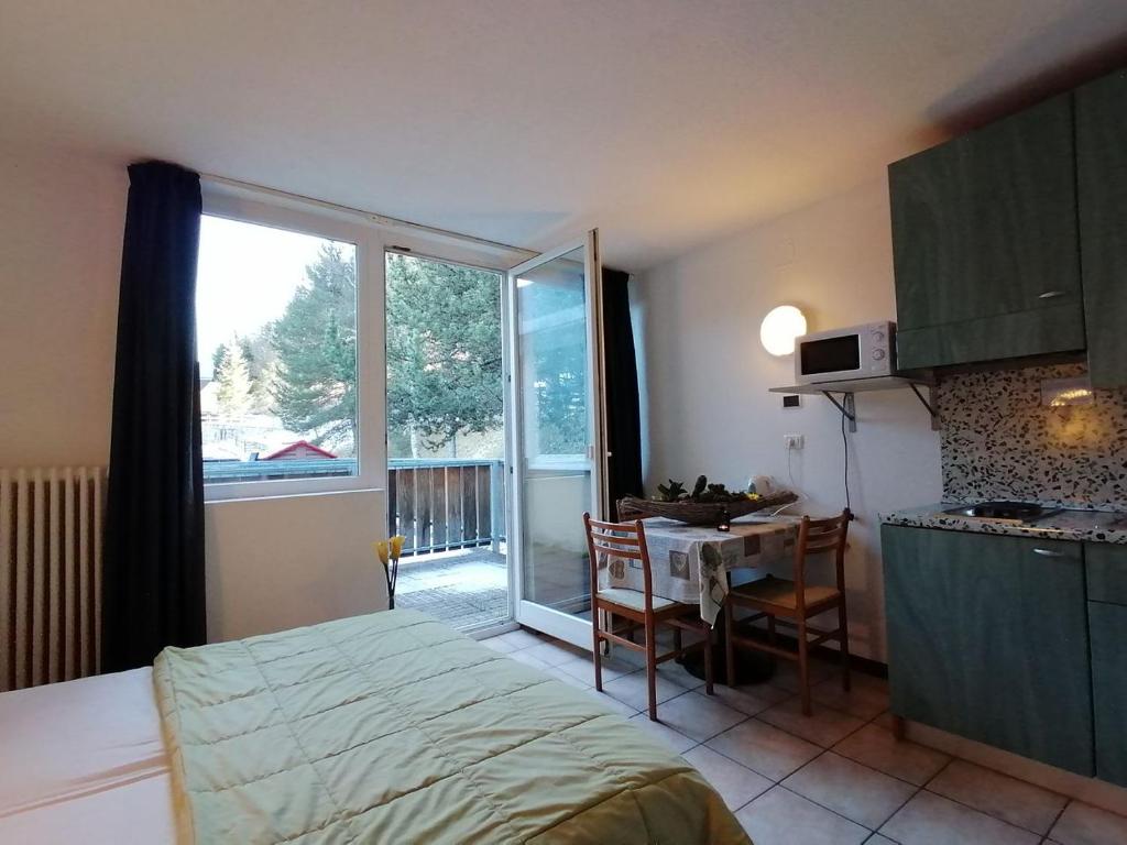 Postel nebo postele na pokoji v ubytování Residence Lores 2 - Go Vacanze
