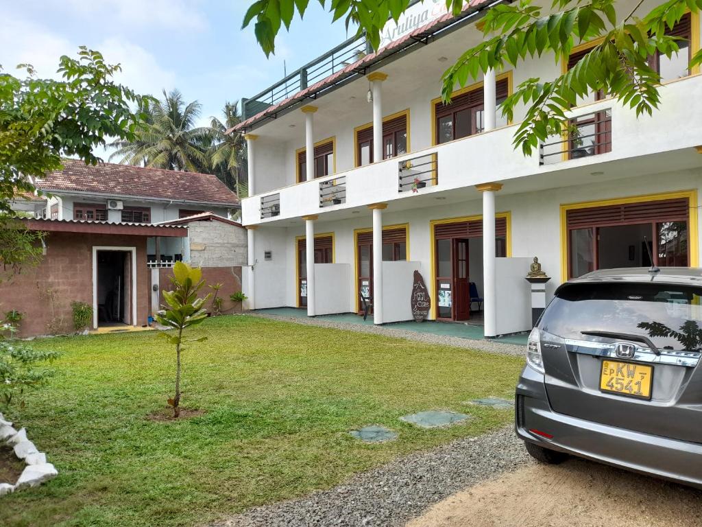 a car parked in front of a house at Aruliya care Resort and Spa in Galle