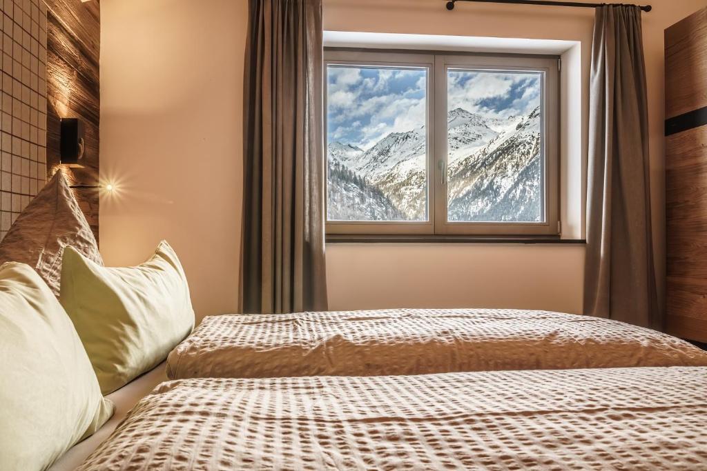 Postel nebo postele na pokoji v ubytování Chalets - The Peak