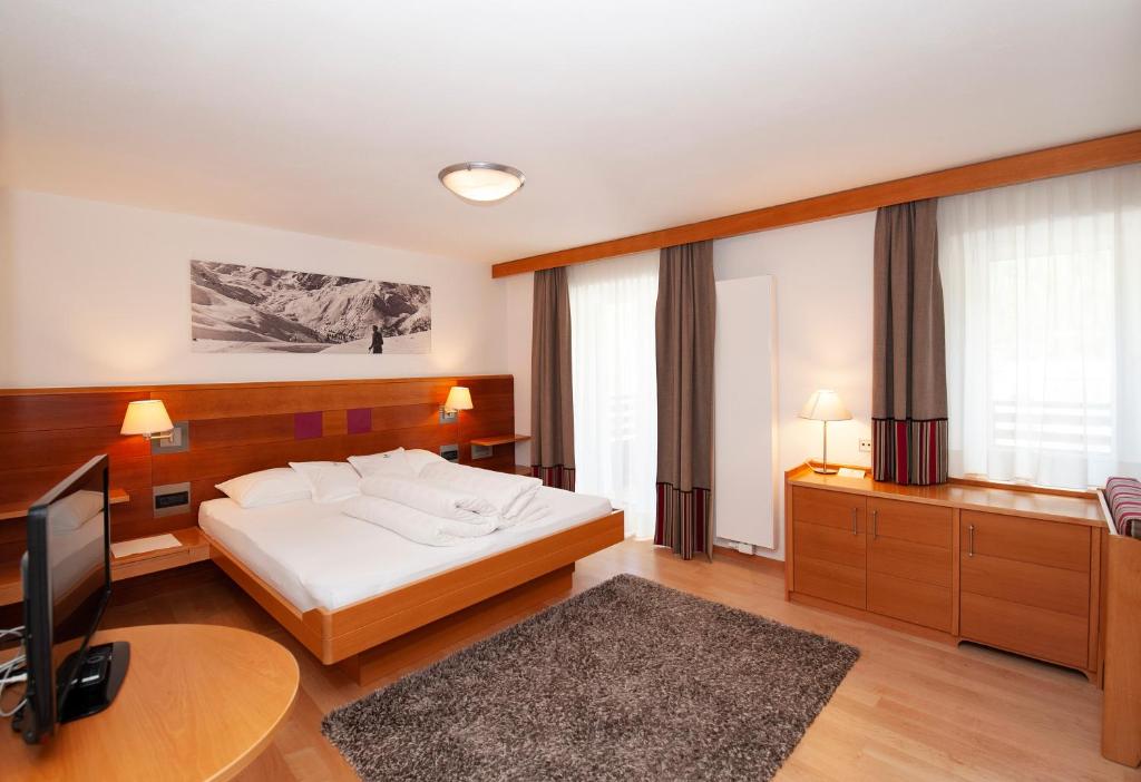 Postel nebo postele na pokoji v ubytování Hotel Eller