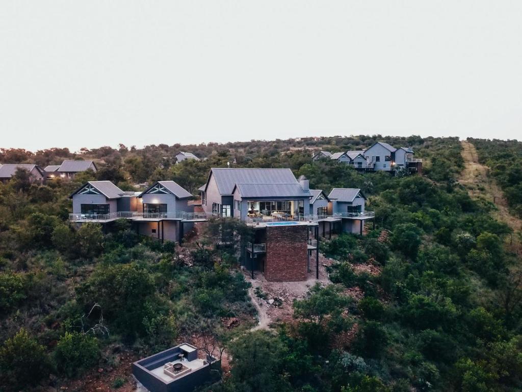 an aerial view of a house on a hill at Elements Bush Lodge in Moheme