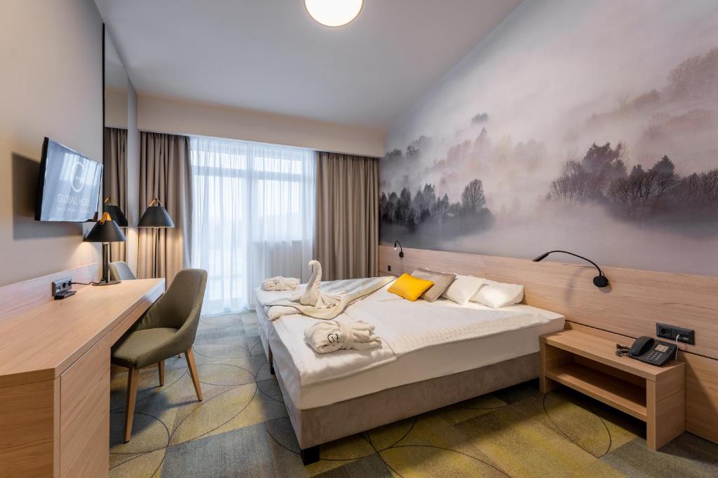 Postel nebo postele na pokoji v ubytování Globall Hotel