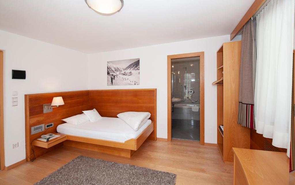 Postel nebo postele na pokoji v ubytování Hotel Eller