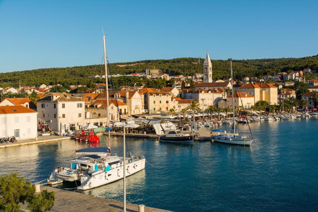 a group of boats are docked in a harbor at Apartments Island Beat in Supetar