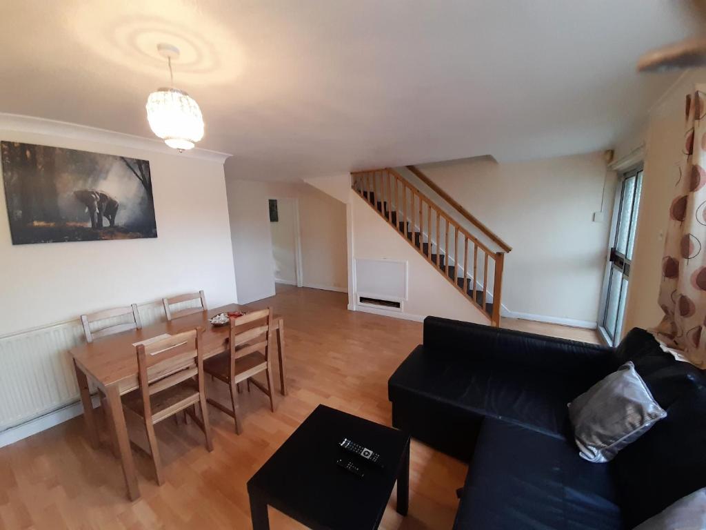 a living room with a couch and a table at Kingswood House in Nottingham