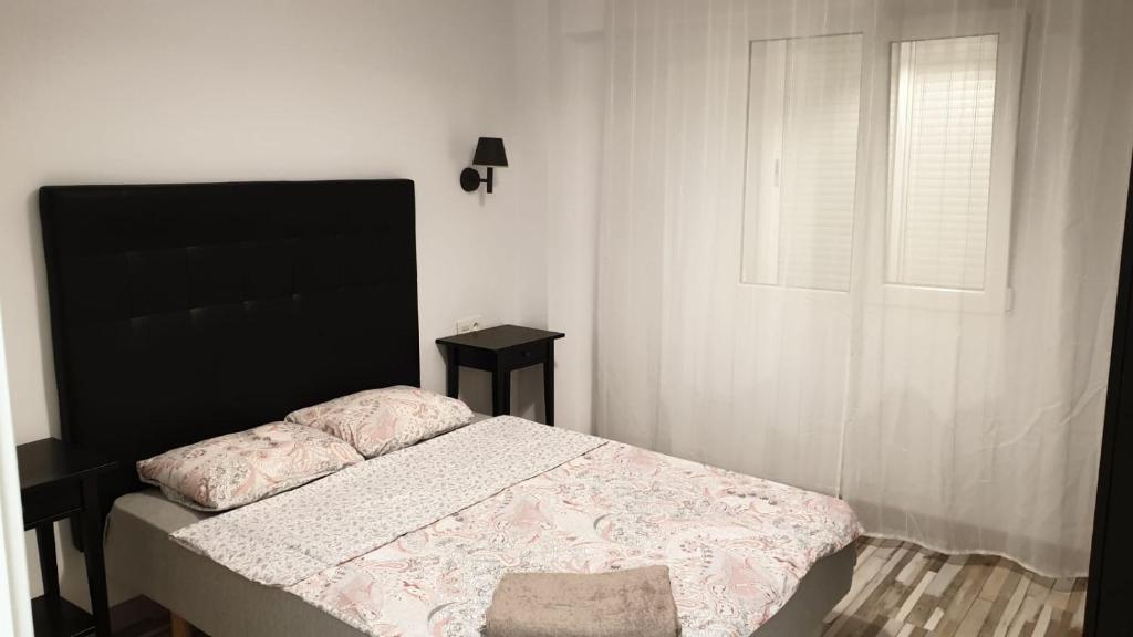 Postel nebo postele na pokoji v ubytování Apartamento Plaza Manila